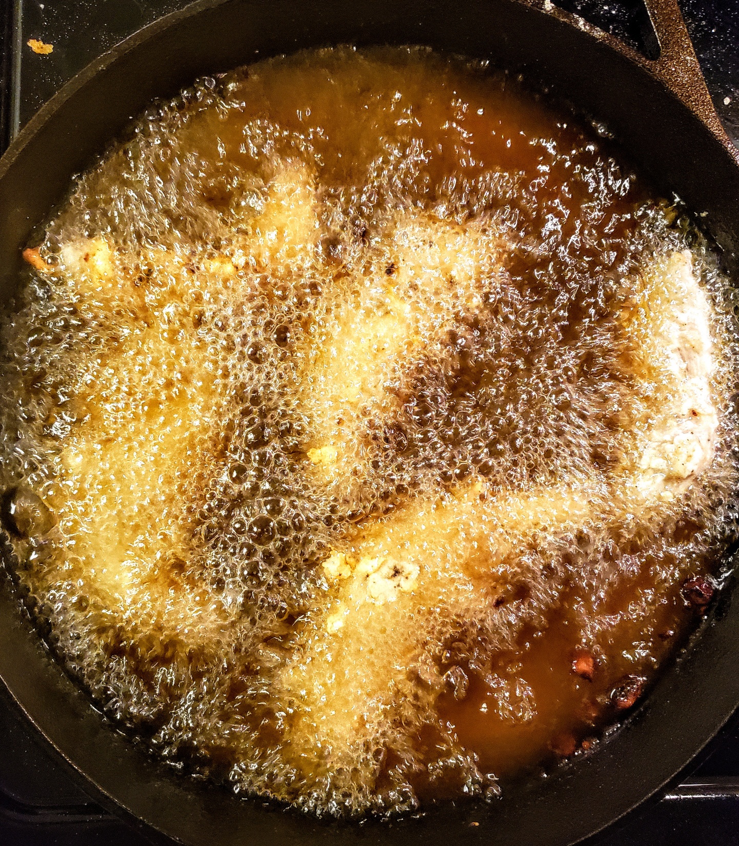 Chicken Strips Or Nuggets Being Deep-fried In A Cast-iron Frying Pan Stock  Photo, Picture and Royalty Free Image. Image 34218325.